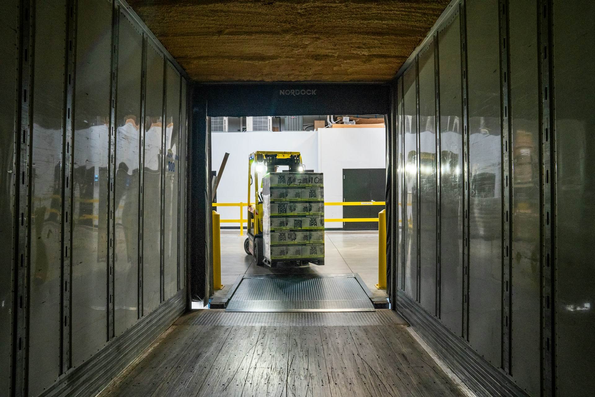 Illustrative photo of a warehouse loading dock viewed from a trailer